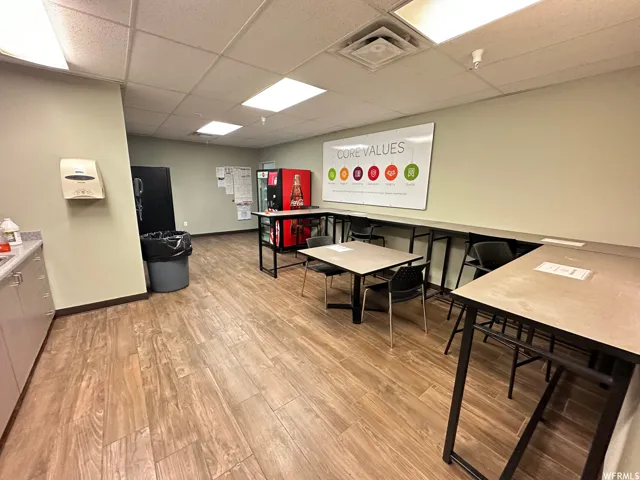 Spacious communal area featuring wood-finish flooring and recessed lighting