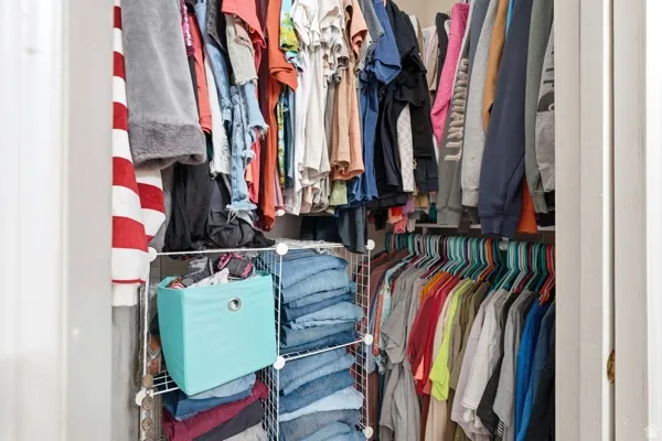Built-in closet system featuring multiple hanging rods and wire shelving