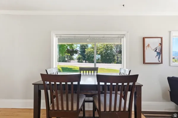 Bright interior featuring light-colored walls and crown molding