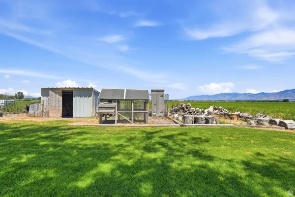 Expansive green lawn with various outbuildings
