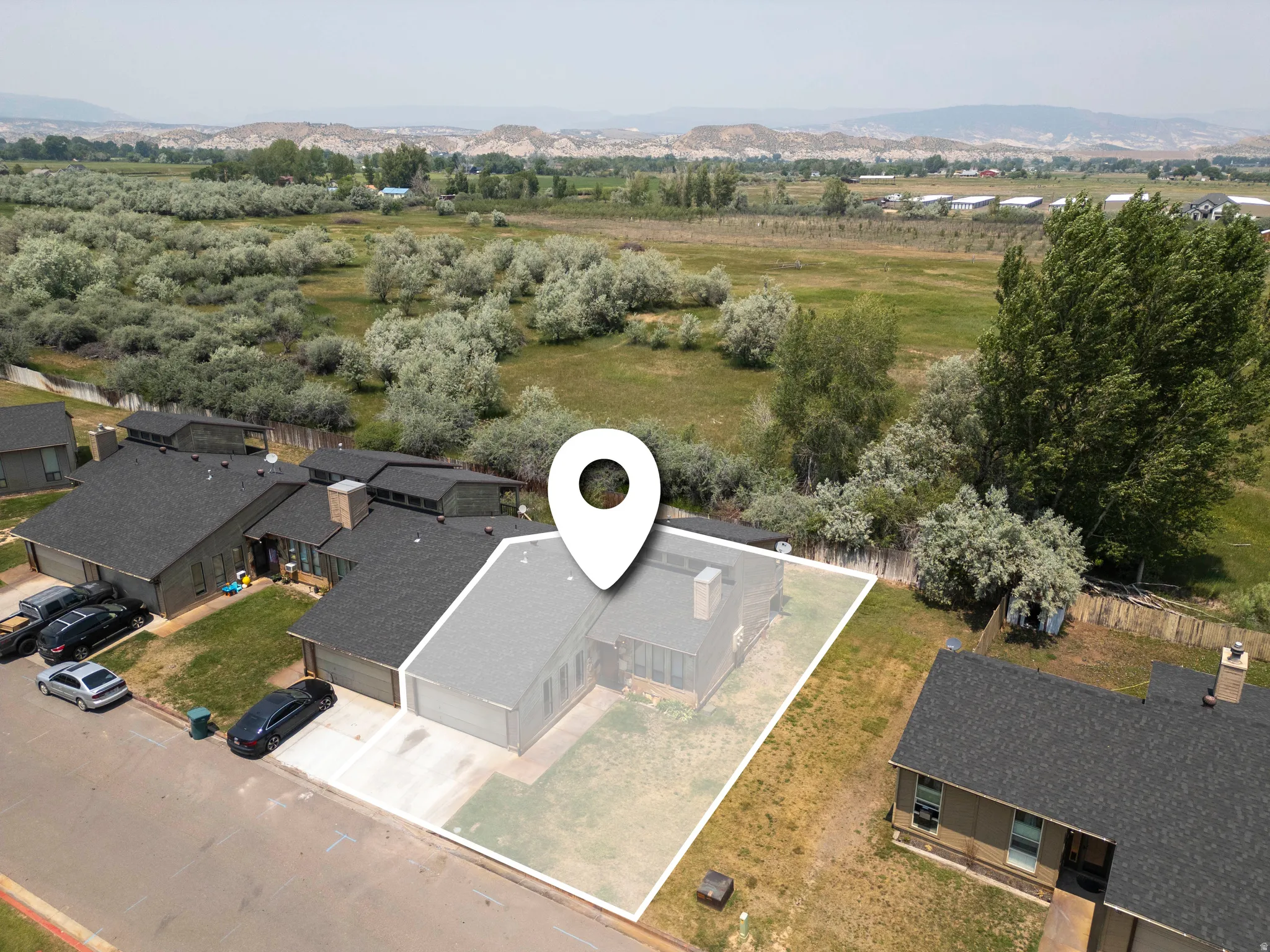 Aerial perspective highlighting the property with a defined lot perimeter
