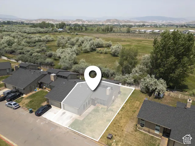 Aerial perspective highlighting the property with a defined lot perimeter