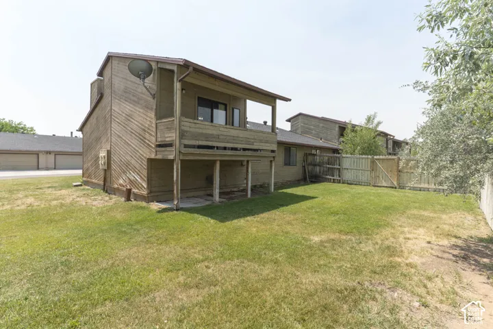 Expansive grass backyard with wood privacy fencing