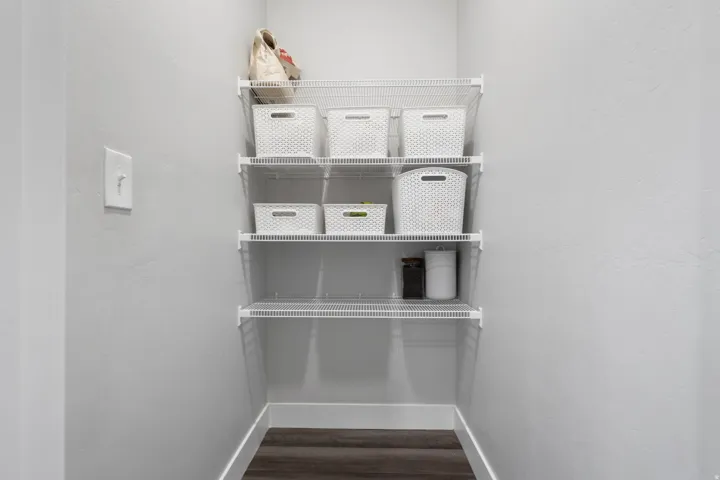Integrated wire shelving system featuring four levels of storage