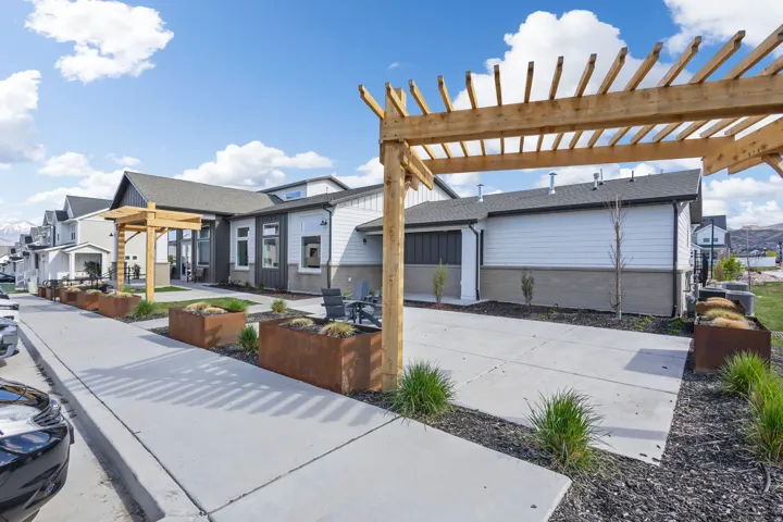 Modern exterior with white siding and dark gray accents