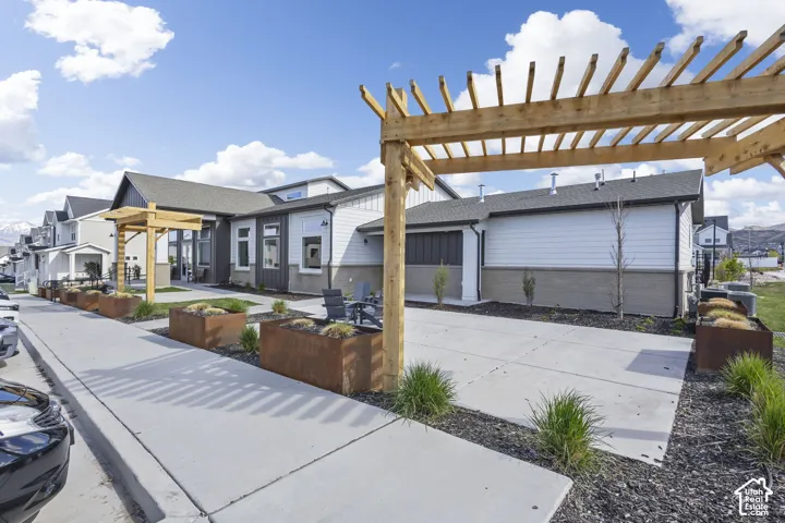 Modern exterior with white siding and dark gray accents