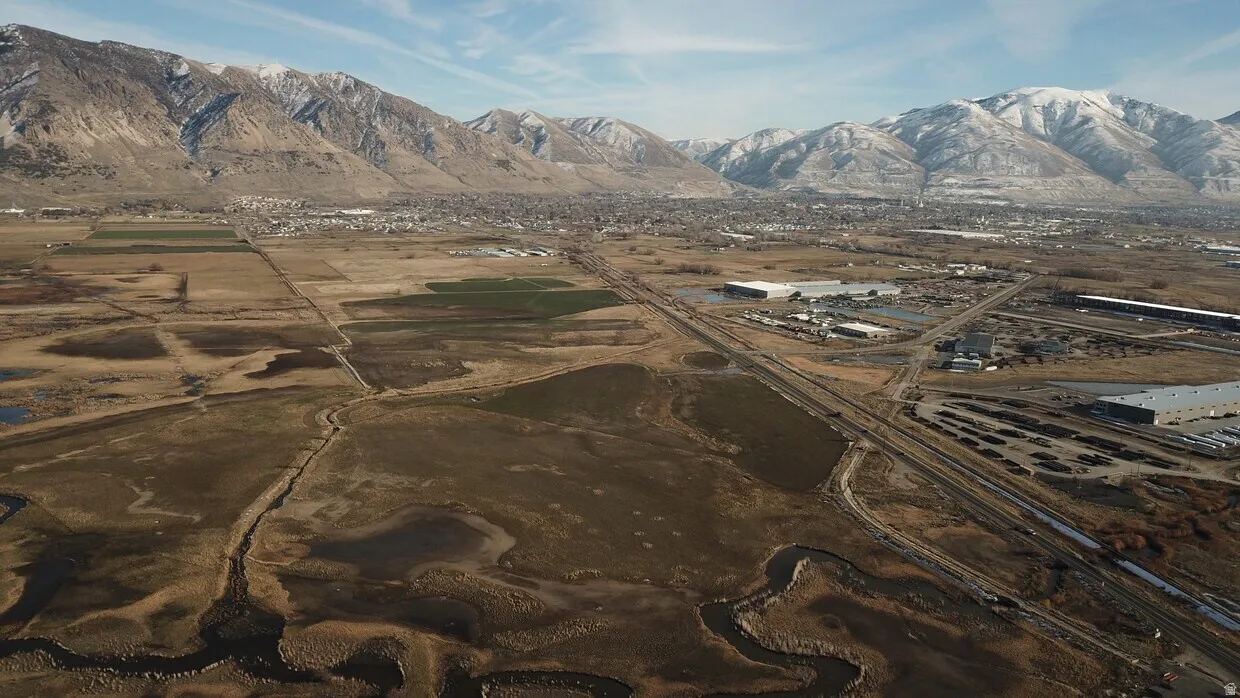 Expansive mountain range backdrop featuring snow-capped peaks