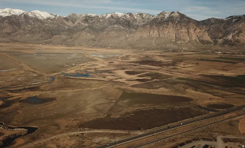 Expansive land parcel featuring natural waterways and varied terrain