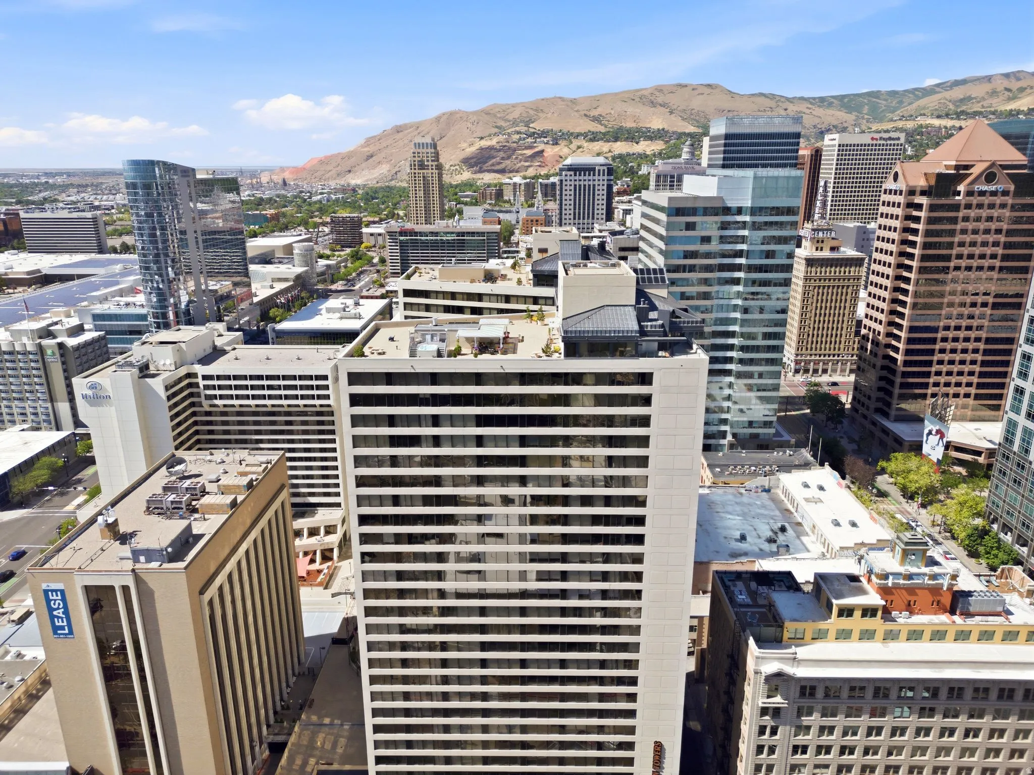 North Skyline view featuring a diverse collection of commercial and residential buildings with a north mountains backdrop