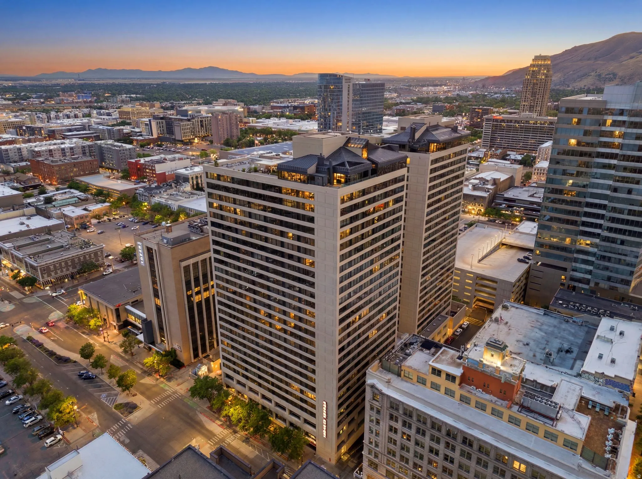 Twilight view of American Towers high-rise buildings, featuring a prominent architectural crown