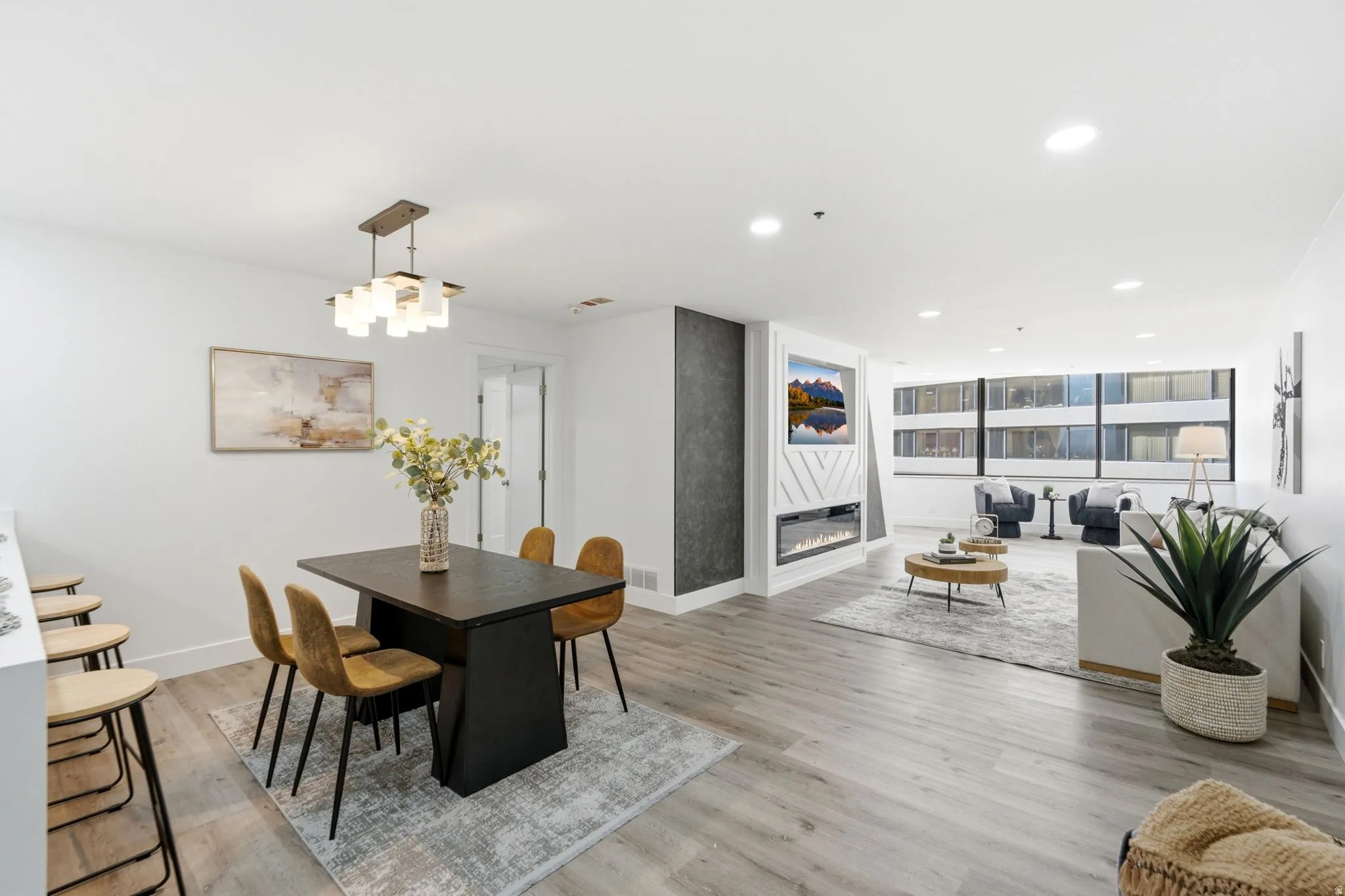 Open concept living area featuring wood-finish flooring