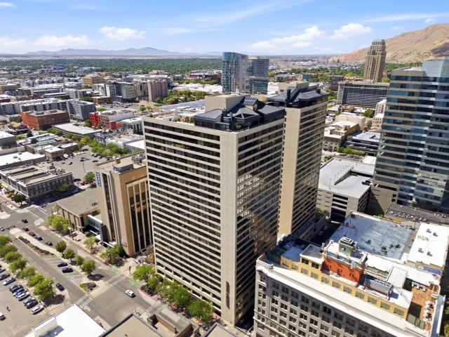 American Towers High-rise buildings featuring a multi-story facade with numerous windows, a flat roofline, and visible rooftop structures