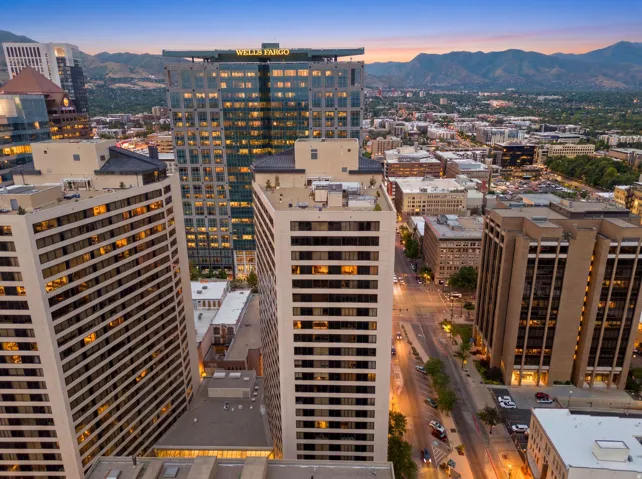 Twilight view of American Towers Urban skyline featuring multiple high-rise buildings and distant mountains