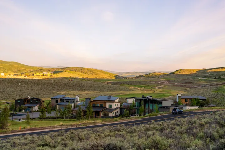 Scenic mountainous landscape with a collection of modern residences