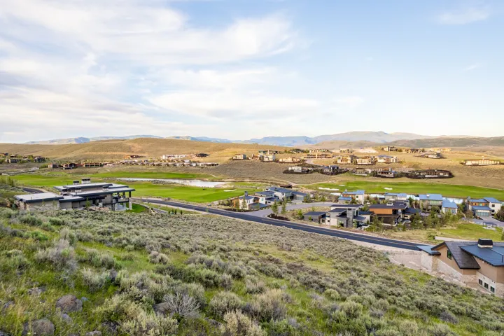 Expansive landscape featuring rolling hills and distant mountains