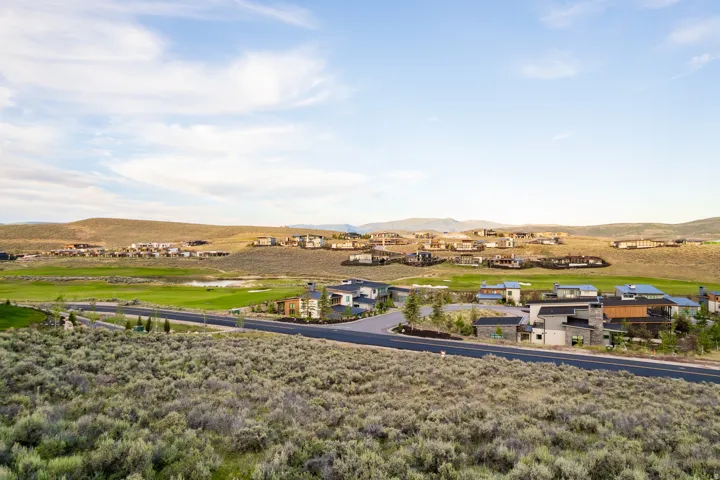 Expansive landscape featuring rugged terrain and distant mountain ranges