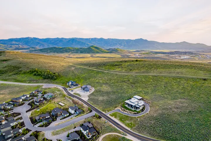 Expansive landscape featuring rolling hills and distant mountains