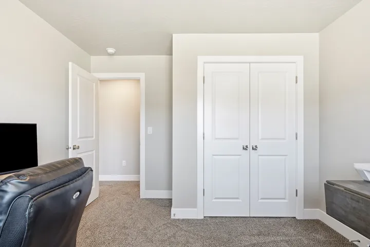 Neutral-toned interior featuring plush carpeting and white trim