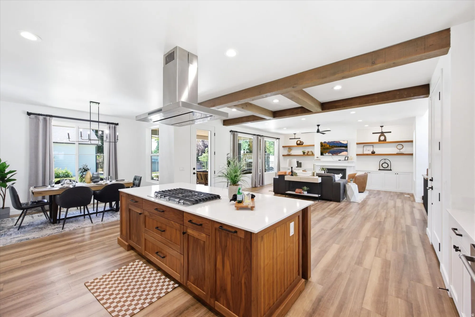 Open concept living space featuring wood-finish flooring