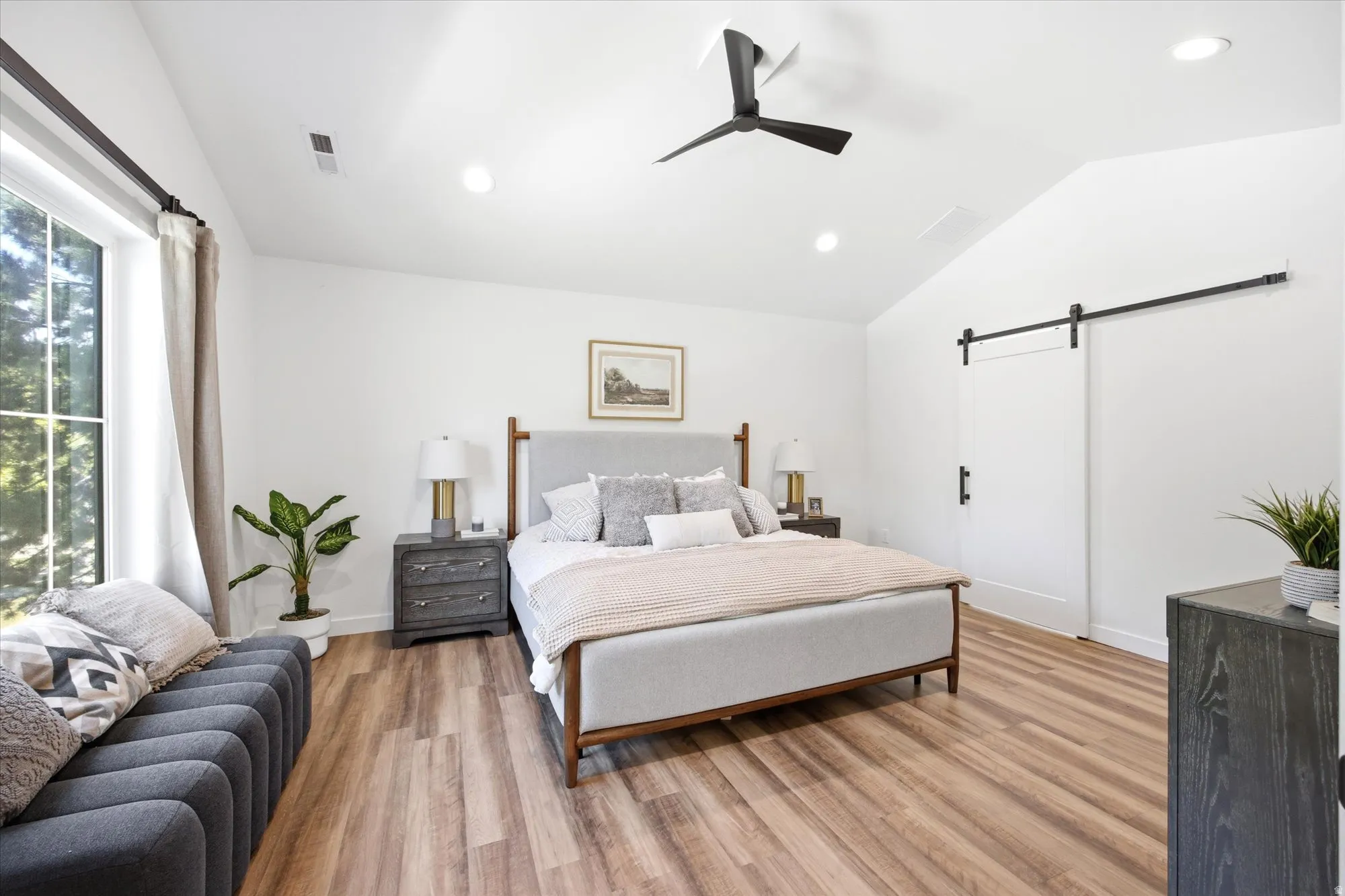 Vaulted ceiling featuring a contemporary ceiling fan and recessed lighting