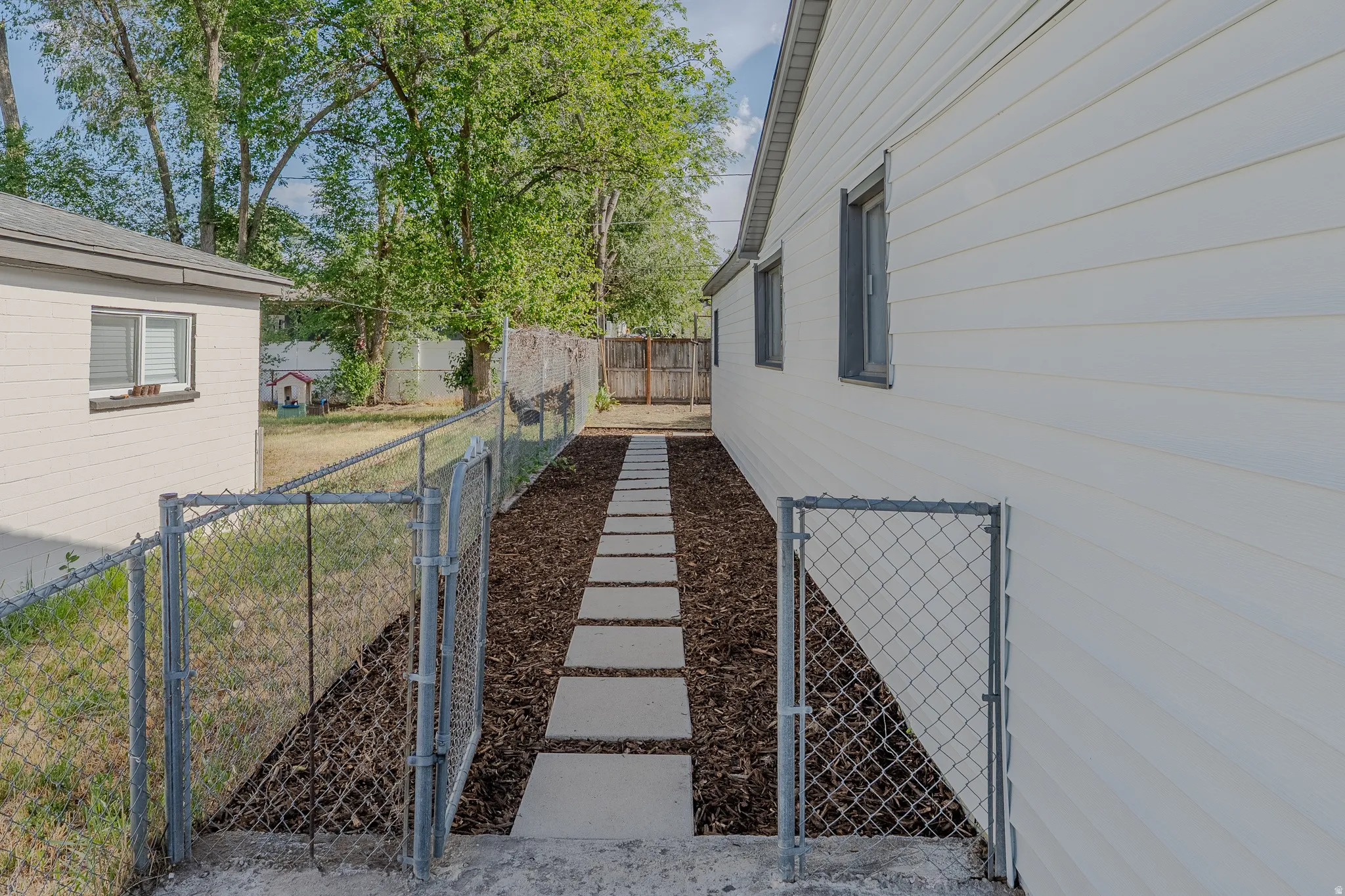 Chain-link fencing defining the property boundary