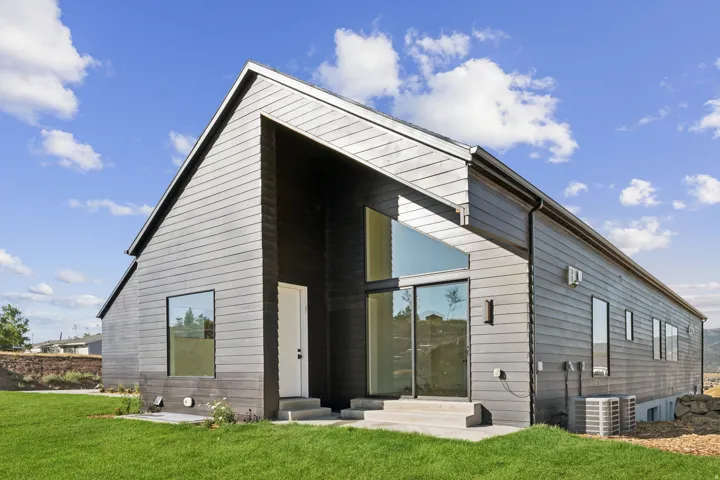 Modern architectural exterior with dark horizontal siding