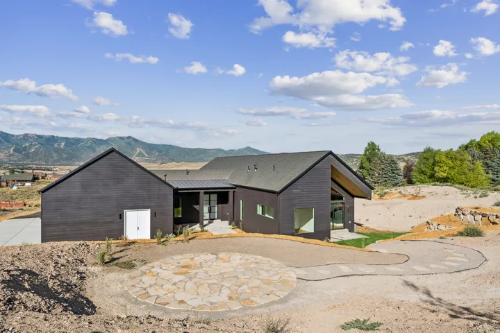 Modern dark-toned exterior with a prominent A-frame architectural element