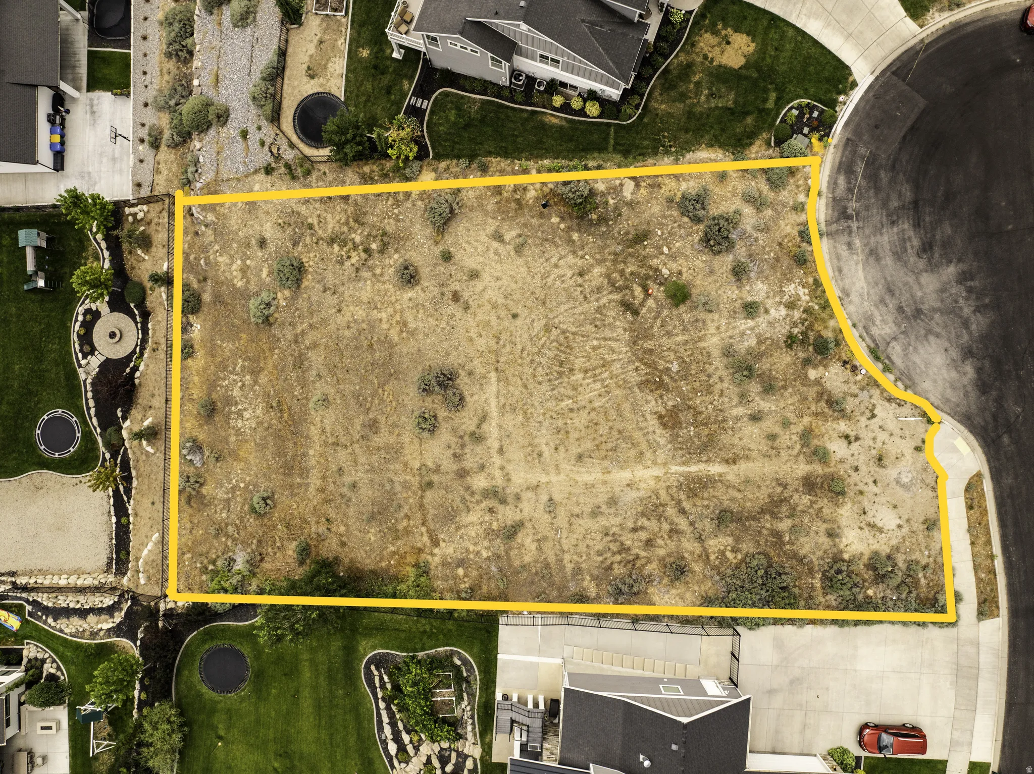Aeriel view of lot surrounded by established homes in up scale neighborhood.
