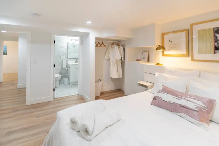 Bedroom featuring light wood-finish flooring, recessed lighting, and a built-in open closet area
