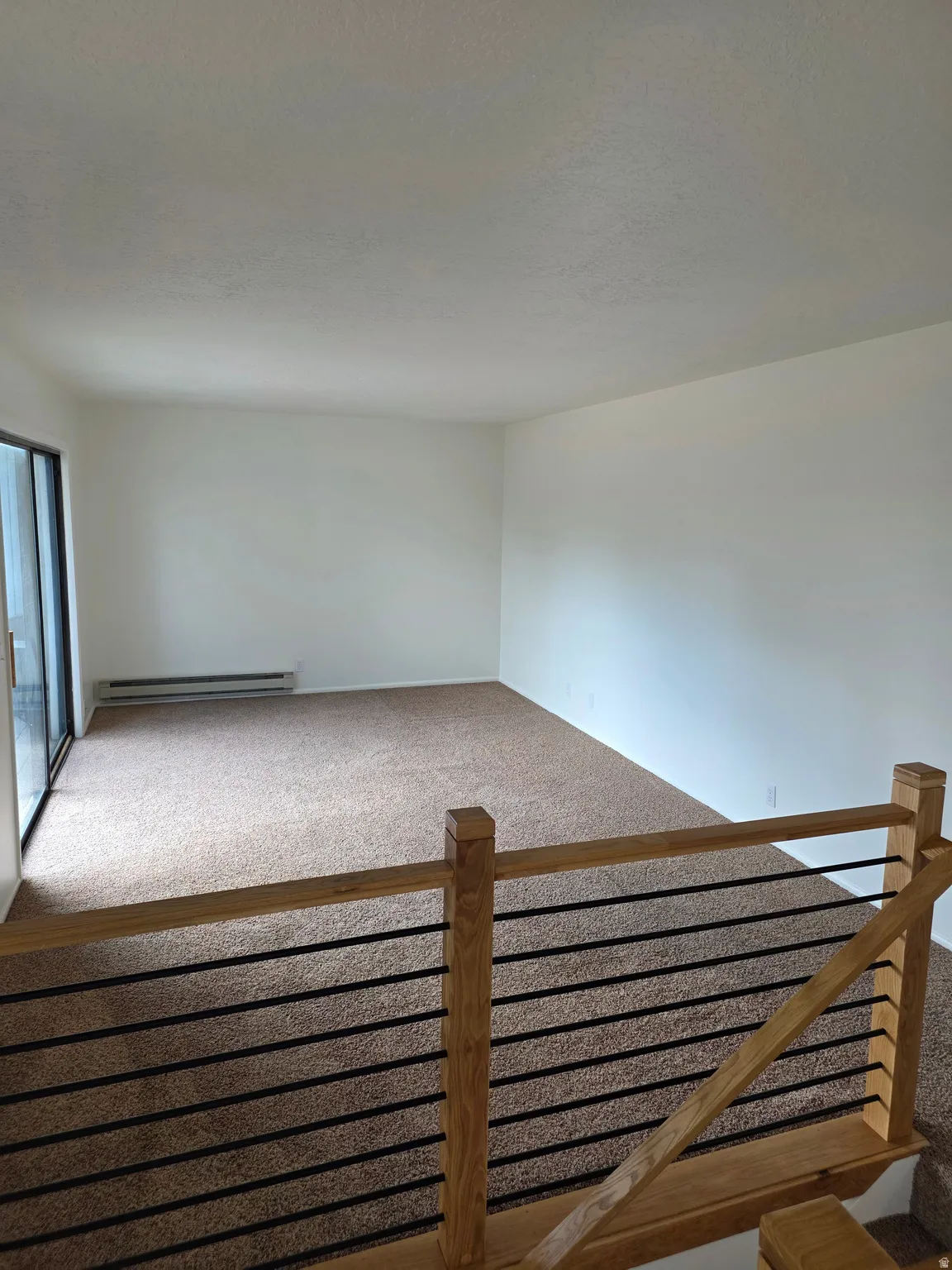 Living room with sliding doors to private patio.