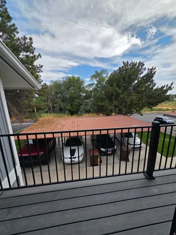 1 space carport next to plenty of guest parking, half basketball court, picnic tables, playground and community swimming pool.