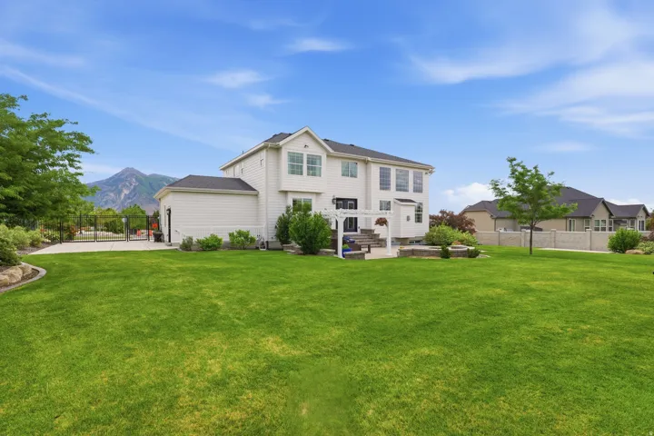 Expansive green lawn with mountain backdrop