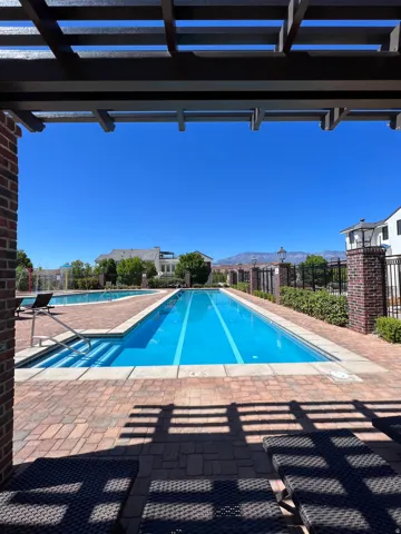 Community swimming pool featuring lap lanes and integrated steps