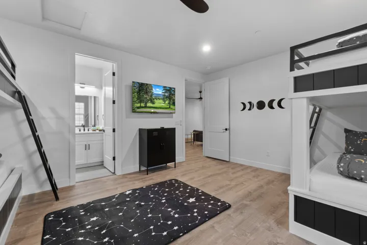 Interior room featuring plank wood-finish flooring and white walls
