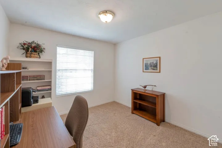 Neutral wall paint and carpeting throughout