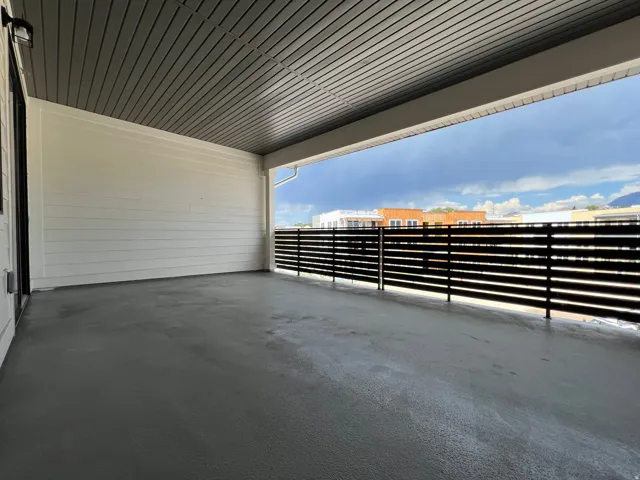 Spacious covered patio with concrete flooring