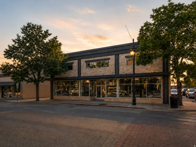 Commercial building featuring extensive street-level display windows