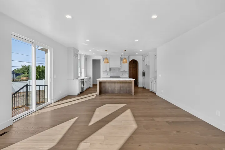 Open-concept layout with wood-finish flooring