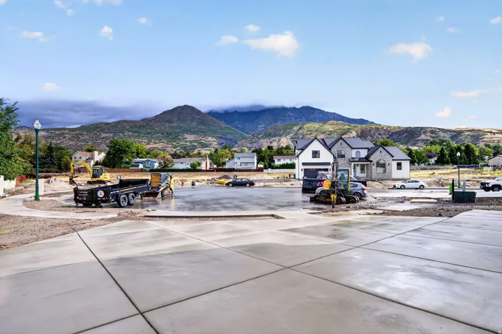 Freshly poured concrete surfacing with a mountain backdrop