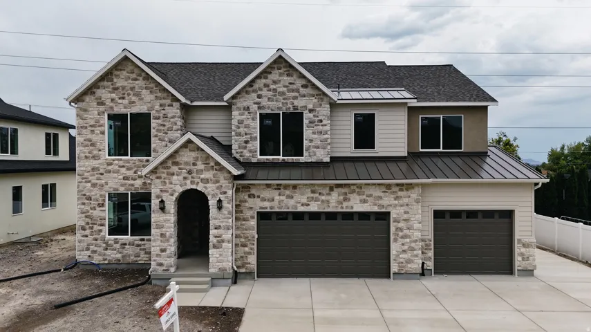 Stone and siding exterior with a dark shingle roof
