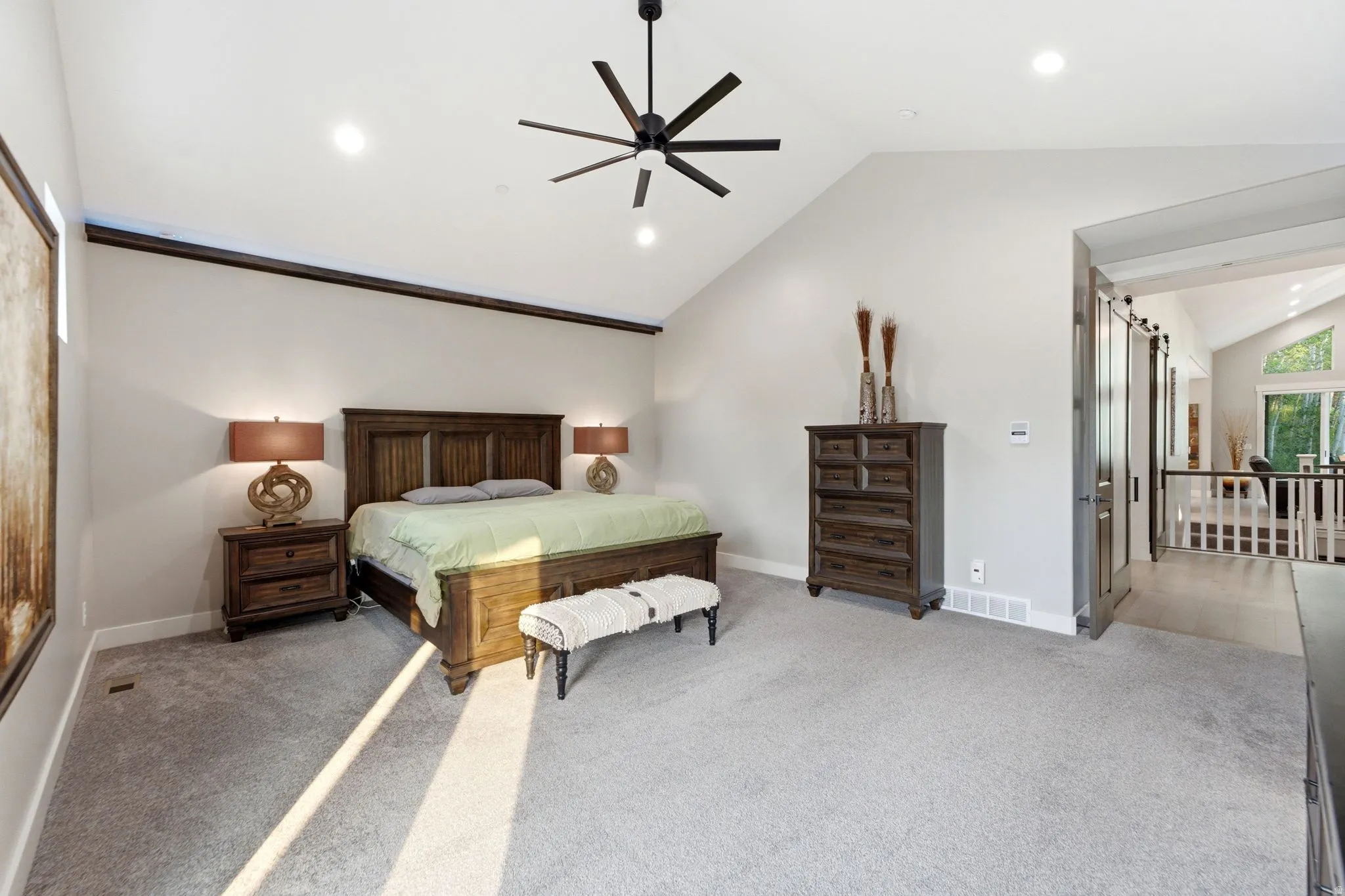 Vaulted ceiling bedroom with recessed lighting and a contemporary ceiling fan