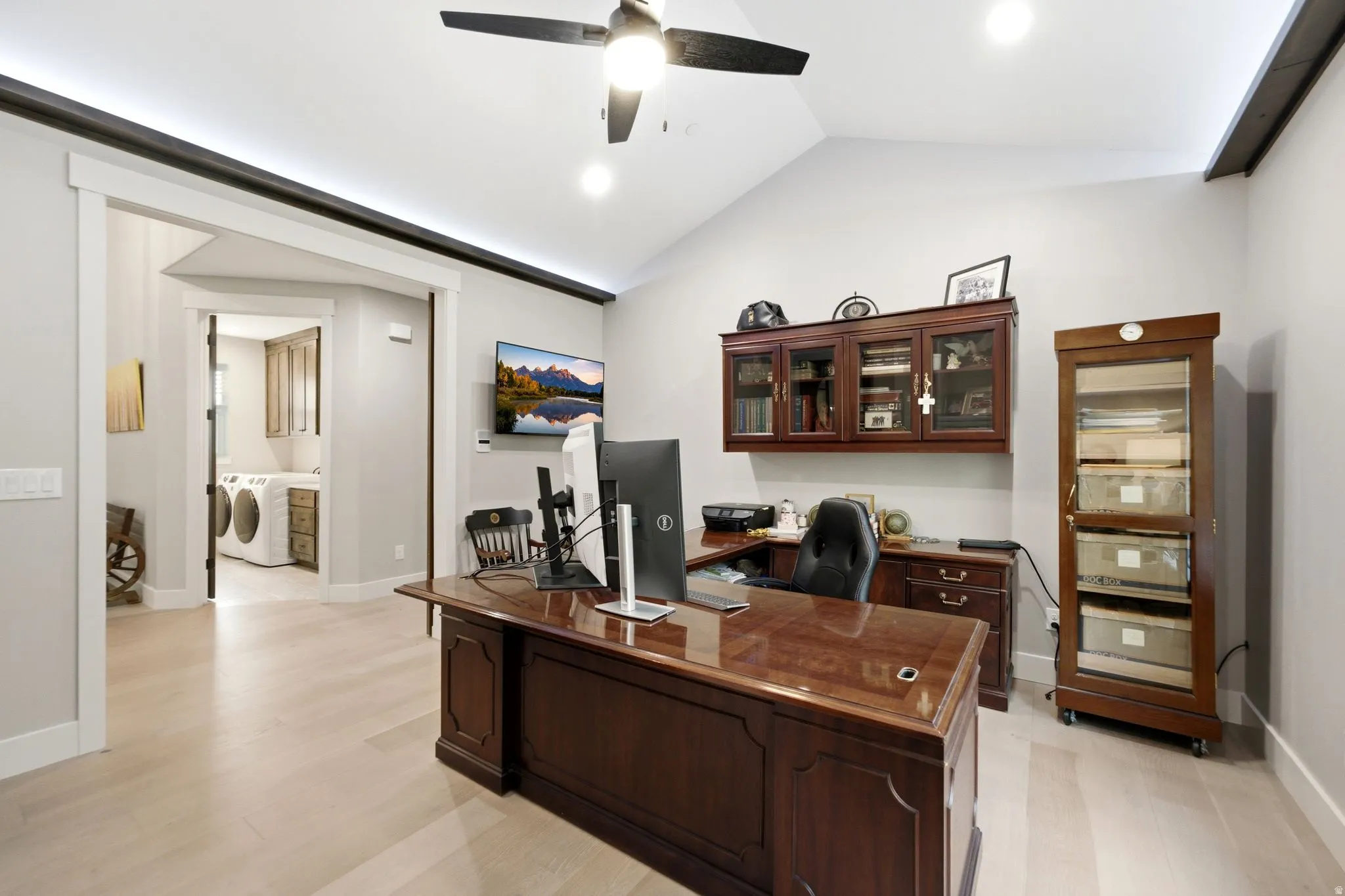 Vaulted ceiling office space featuring wood-finish flooring, recessed lighting, and a dark wood ceiling fan