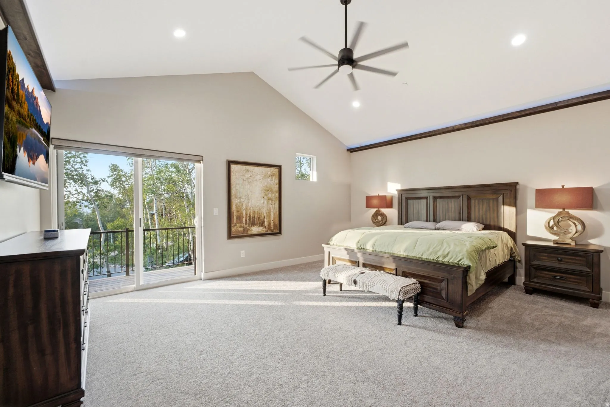 Vaulted ceiling room with recessed lighting and a ceiling fan