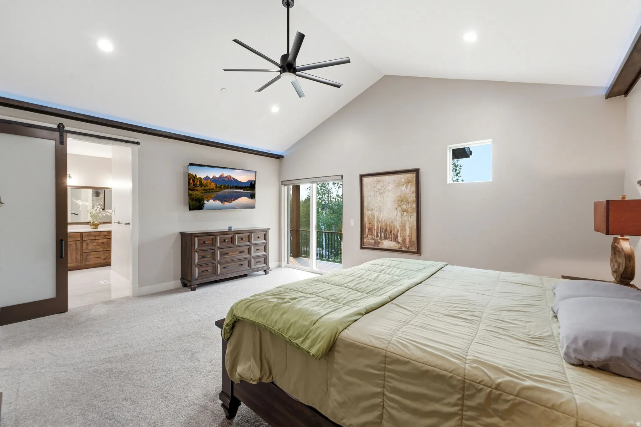 Vaulted ceiling featuring a contemporary ceiling fan, recessed lighting, and a sliding glass door to exterior