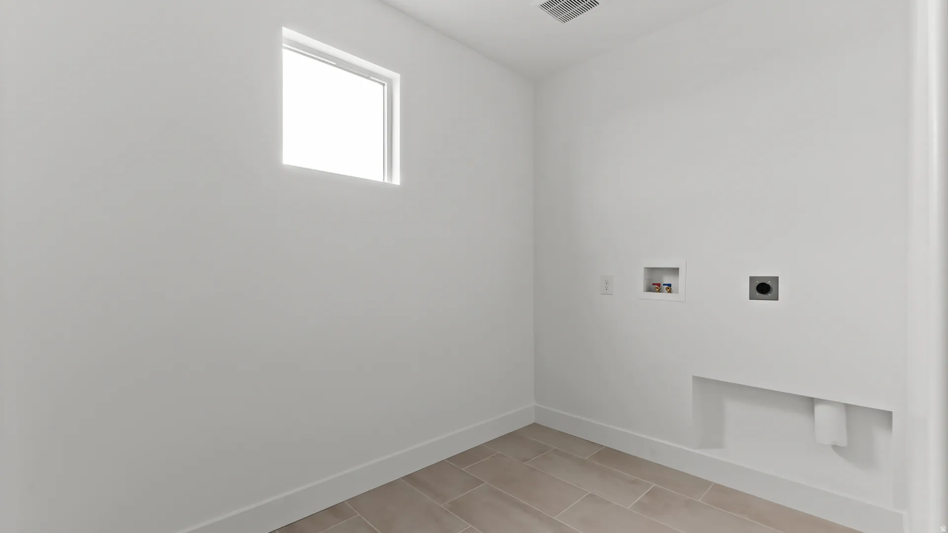 Functional utility room with wood-look tile flooring, a high square window, and a built-in shelf