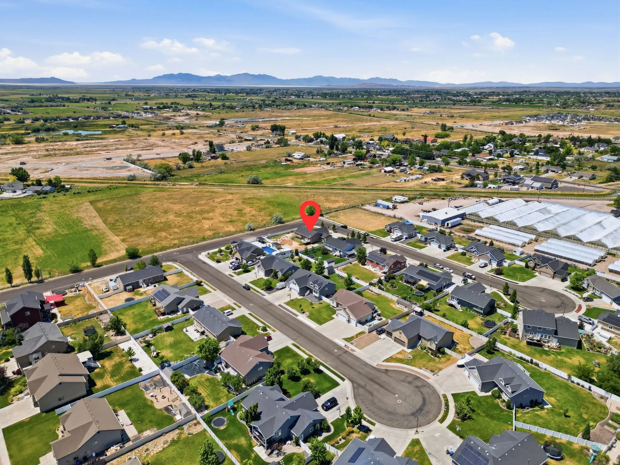 Aerial perspective showcasing a residential neighborhood with various home designs