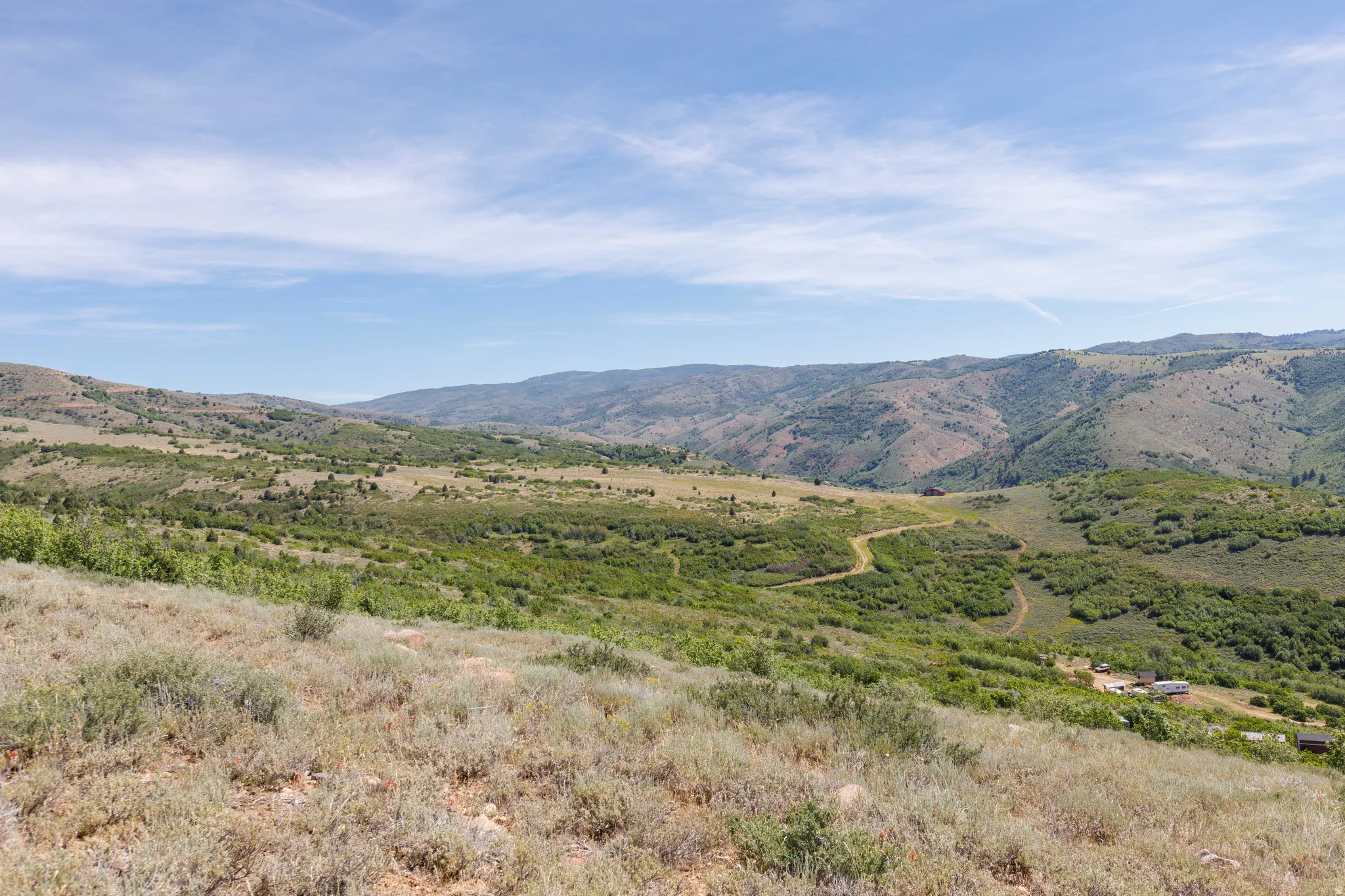 Expansive mountainous landscape with natural vegetation