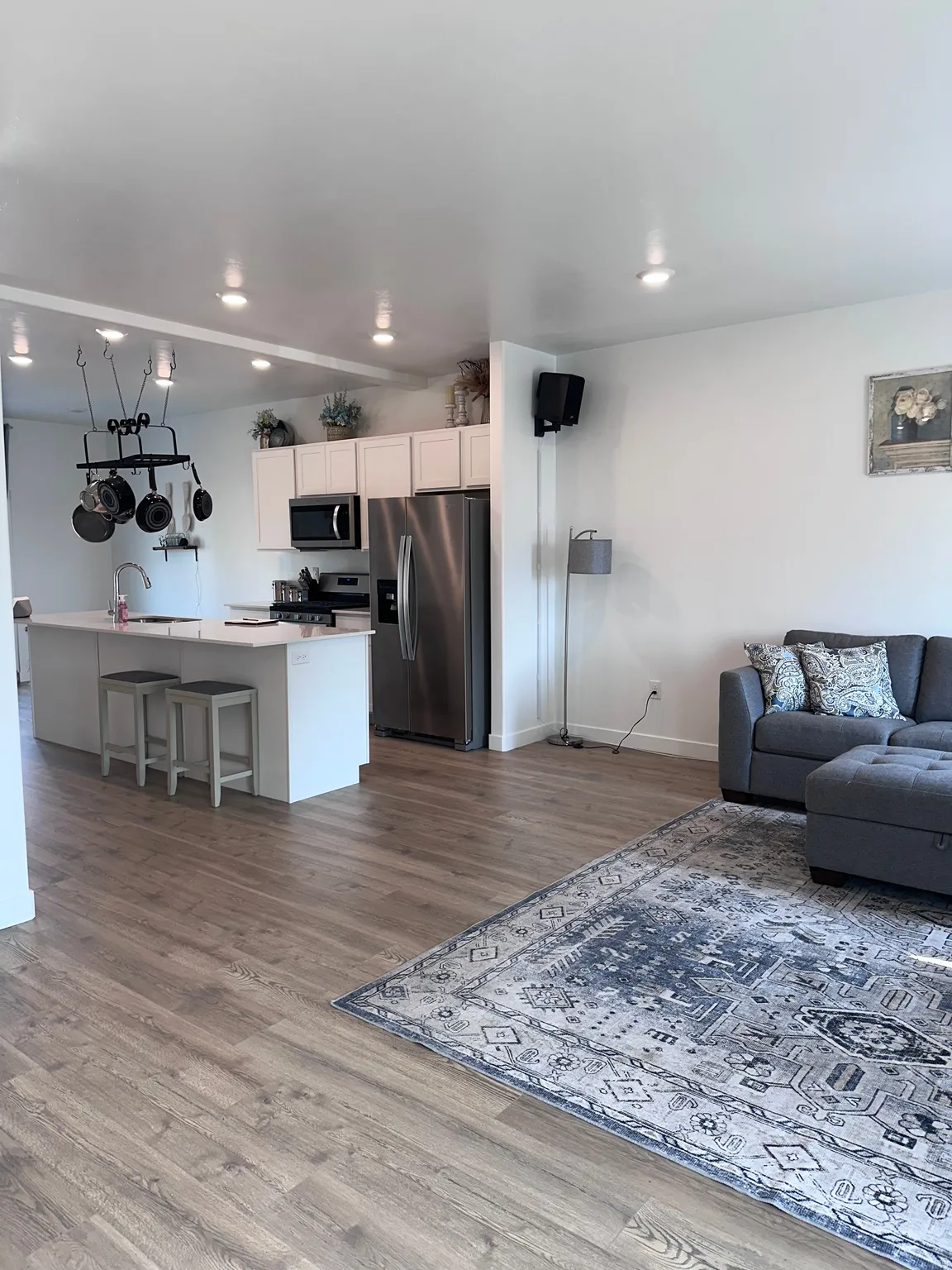 Open-concept living space featuring wood-finish flooring