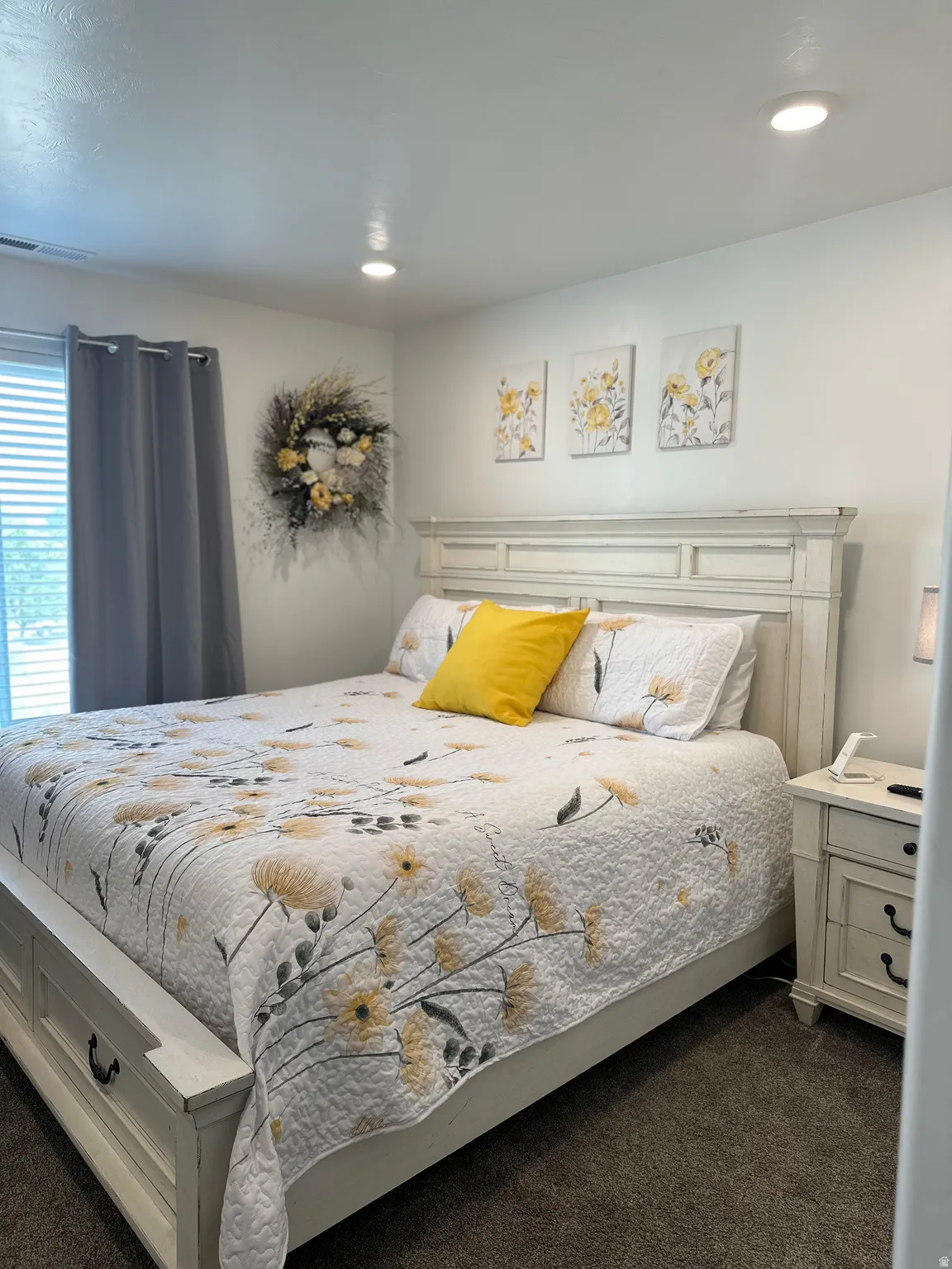 Comfortable bedroom featuring recessed ceiling lighting, a window with horizontal blinds, and soft carpet flooring