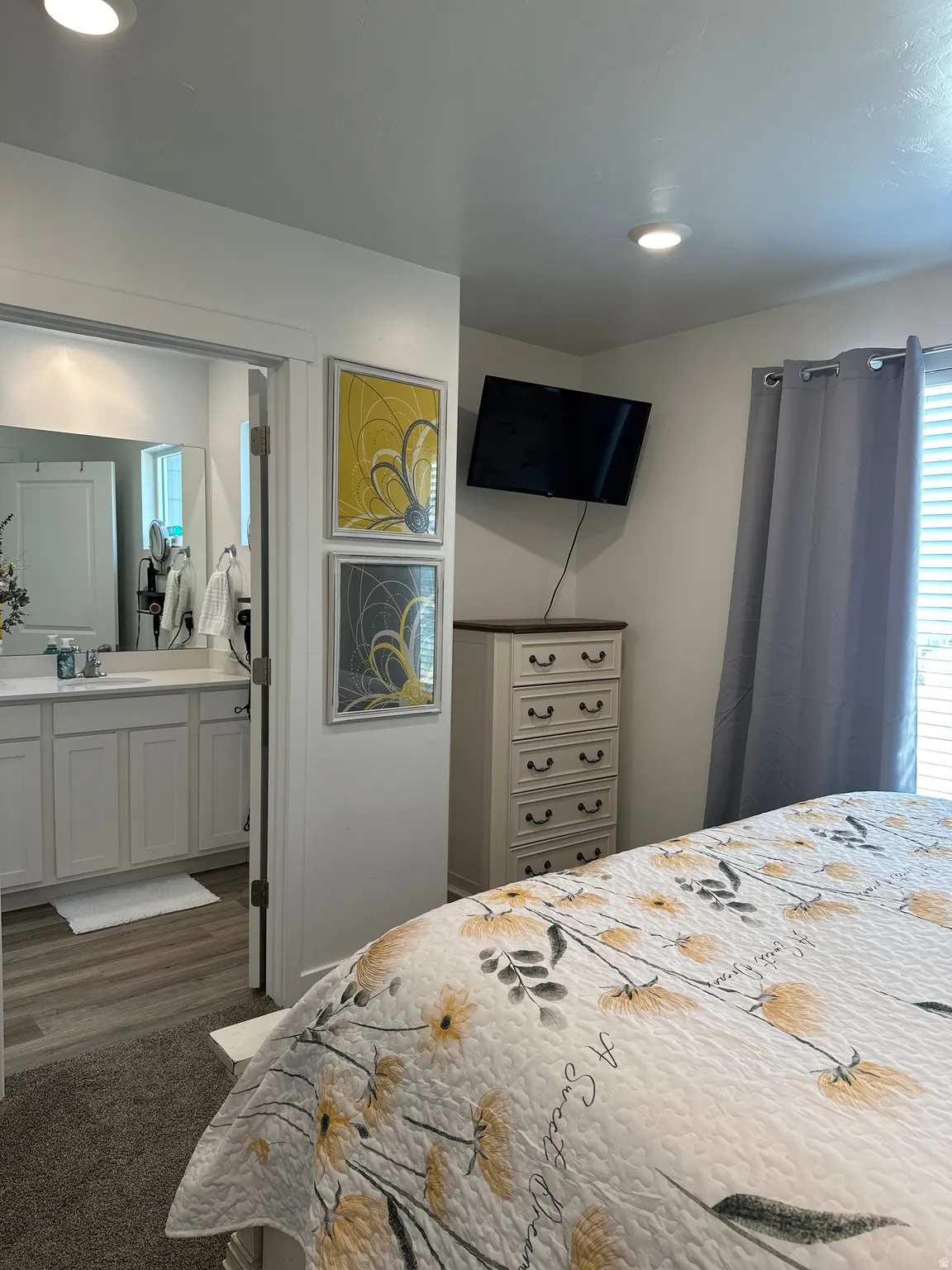 Bedroom featuring recessed lighting, carpet flooring, and a window with blinds and drapes